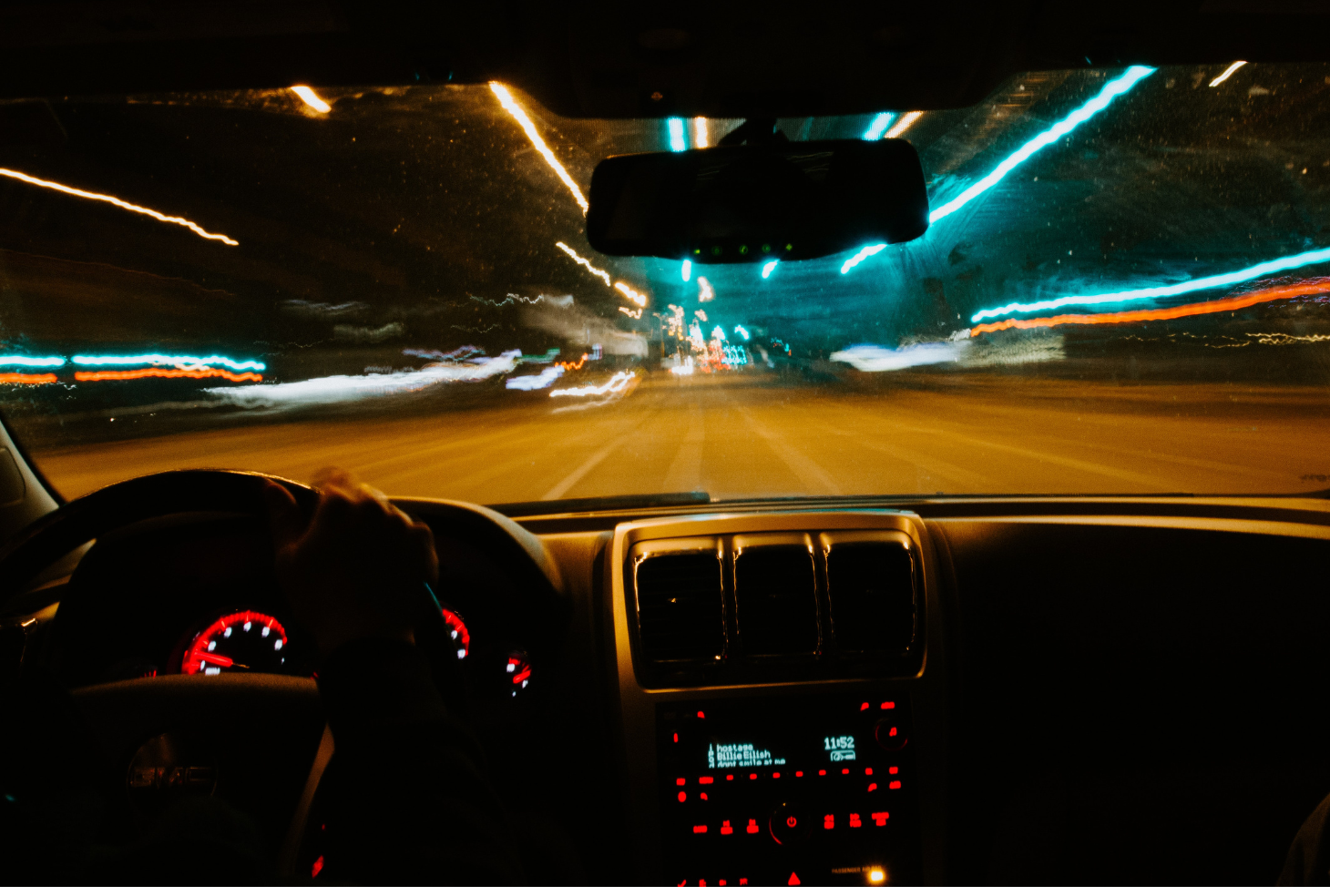 Blurry view through a car windshield at night